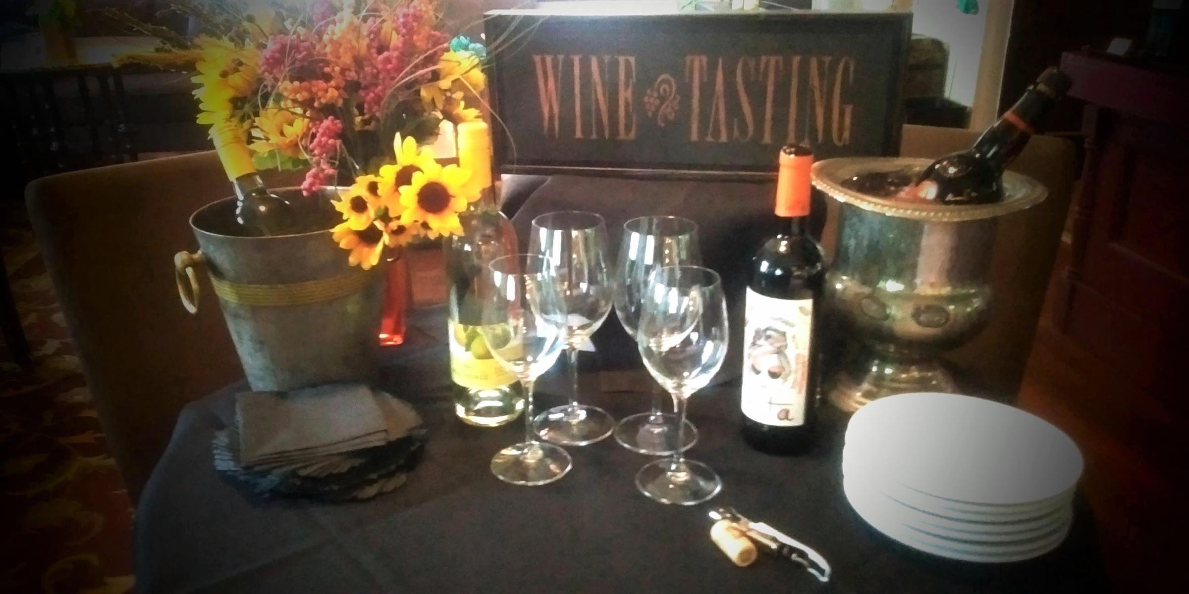 Wine and flowers on table